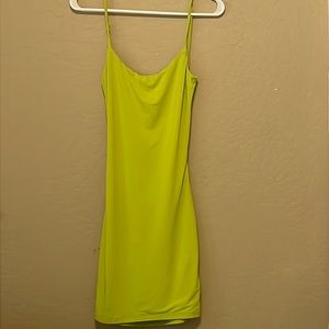 “J for Justify” tight fit open back short neon green dress. Size small.